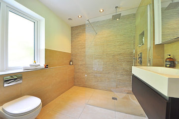 shower room with hard water stains